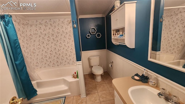 full bathroom featuring a wainscoted wall, tile patterned flooring, toilet, ornamental molding, and vanity