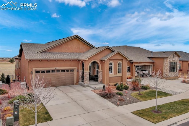 9825 Golf Crest Dr, Peyton, CO 80831 - single story home featuring concrete driveway, roof with shingles, stucco siding, stone siding, and an attached garage