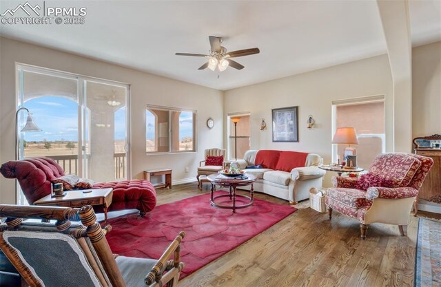 9825 Golf Crest Dr, Peyton, CO 80831 - living room featuring a healthy amount of sunlight, ceiling fan, and wood finished floors