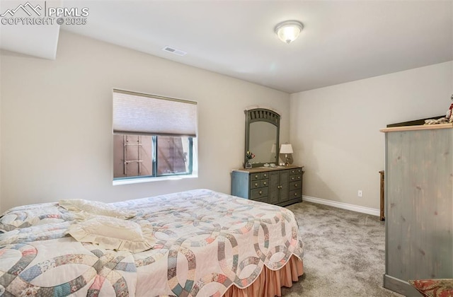 9825 Golf Crest Dr, Peyton, CO 80831 - bedroom featuring baseboards, visible vents, and carpet floors
