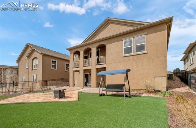 9825 Golf Crest Dr, Peyton, CO 80831 - back of property featuring a yard, fence, and stucco siding