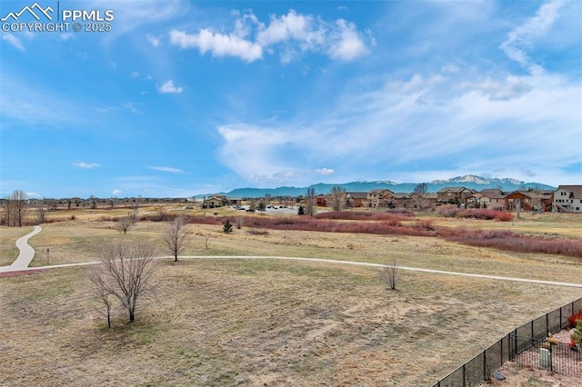 9825 Golf Crest Dr, Peyton, CO 80831 - view of yard featuring a residential view, a mountain view, and fence