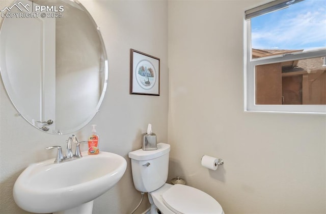 9825 Golf Crest Dr, Peyton, CO 80831 - bathroom featuring toilet and a sink