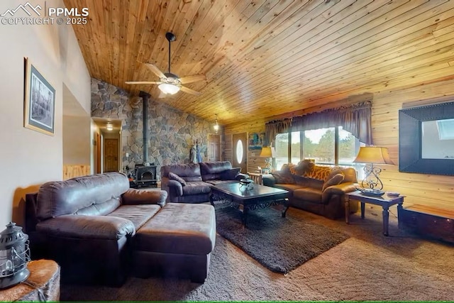 carpeted living room with wood ceiling, a wood stove, a ceiling fan, and vaulted ceiling