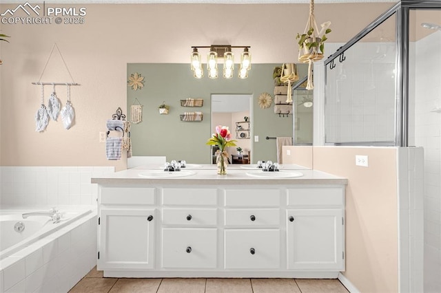 full bath featuring a sink, tile patterned floors, tiled shower, and a garden tub