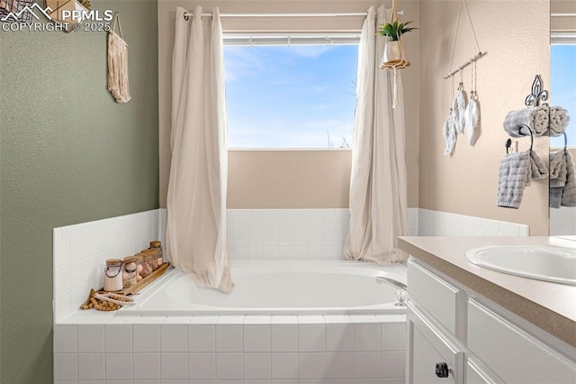 full bath with a bath and vanity