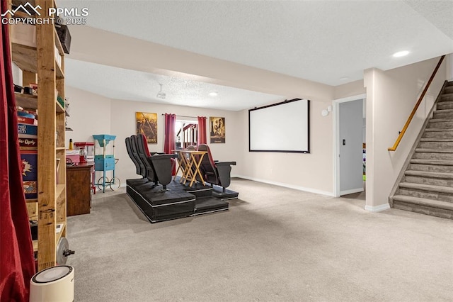 exercise room featuring recessed lighting, carpet flooring, a textured ceiling, and baseboards