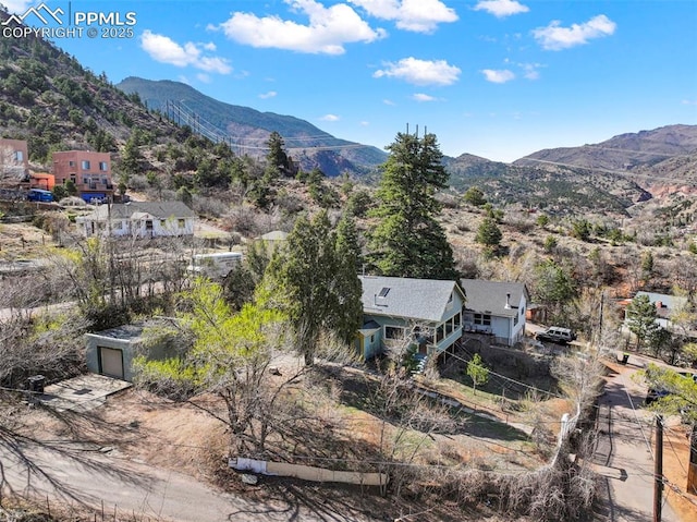 birds eye view of property featuring a mountain view