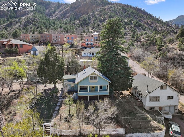 birds eye view of property with a mountain view