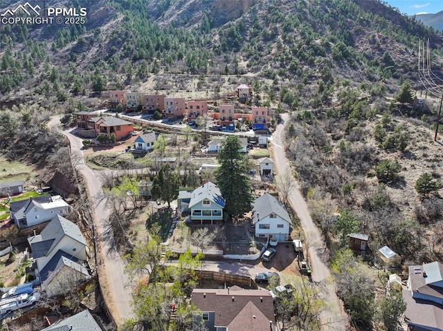 birds eye view of property featuring a mountain view and a residential view