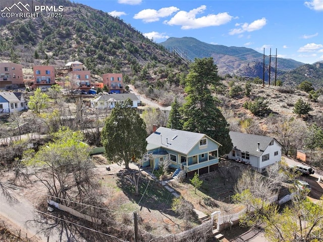 birds eye view of property with a mountain view