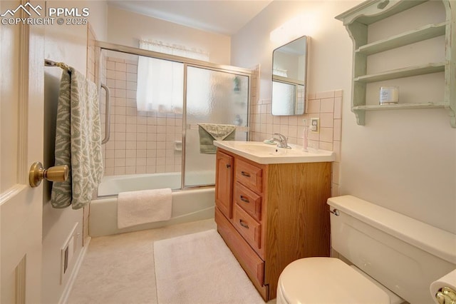 2354 Valley Forge Rd, Colorado Springs, CO 80907 - bathroom with bath / shower combo with glass door, toilet, and vanity