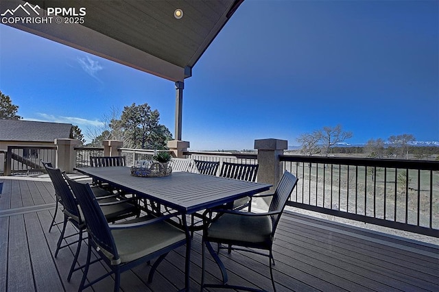 wooden terrace with outdoor dining space