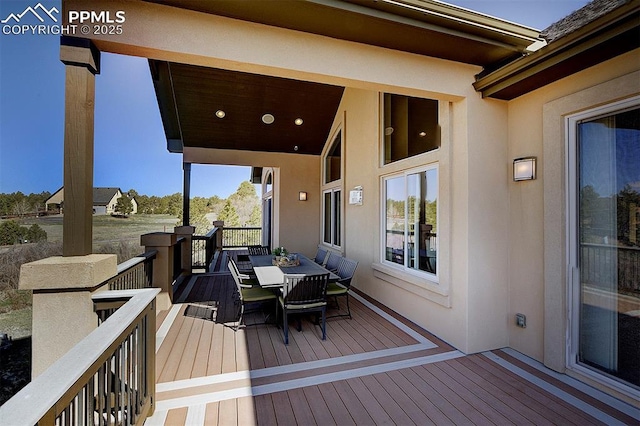 deck with outdoor dining space