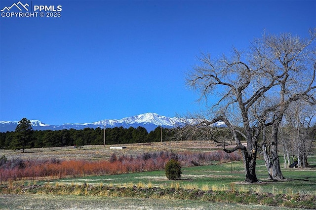 view of mountain feature with a rural view
