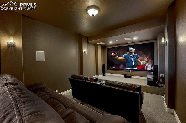 home theater room with carpet and baseboards