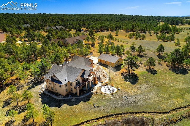 drone / aerial view with a forest view