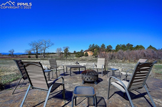 view of patio / terrace with an outdoor fire pit