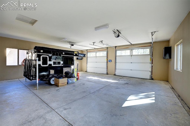 garage featuring a garage door opener
