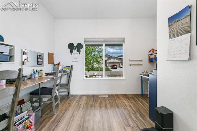 office area with wood finished floors and baseboards