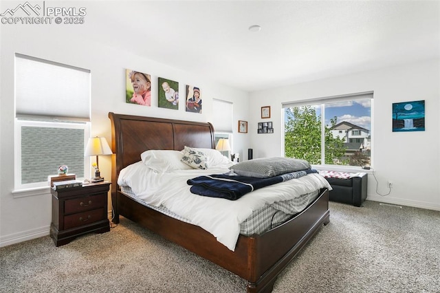 bedroom with carpet flooring and baseboards