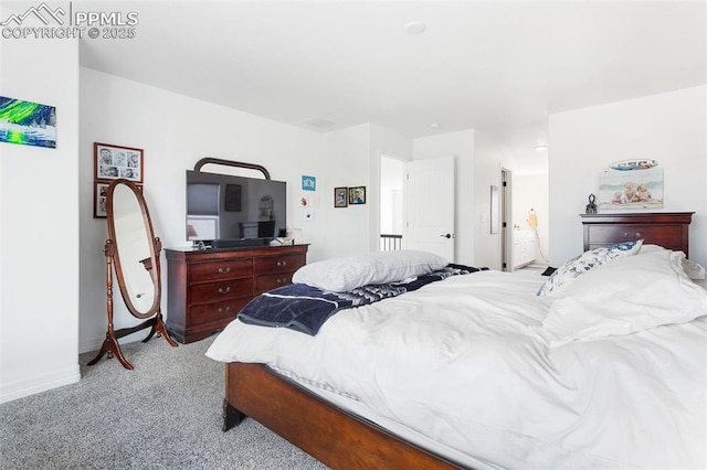 carpeted bedroom featuring baseboards