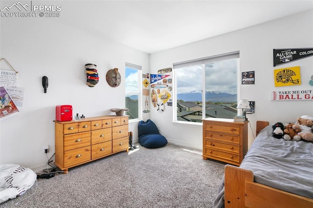 bedroom featuring carpet flooring and baseboards