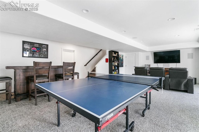 rec room with carpet, a bar, and recessed lighting