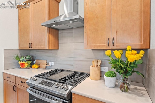 48 Mayflower Park Pl, Colorado Springs, CO 80905 - kitchen featuring wall chimney range hood, stainless steel range with gas cooktop, tasteful backsplash, and light countertops