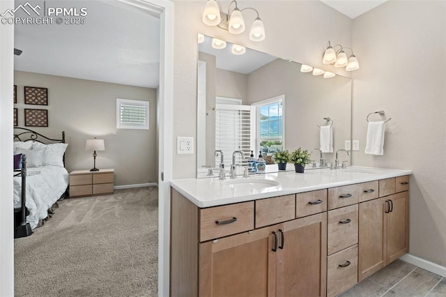 48 Mayflower Park Pl, Colorado Springs, CO 80905 - ensuite bathroom featuring double vanity and baseboards