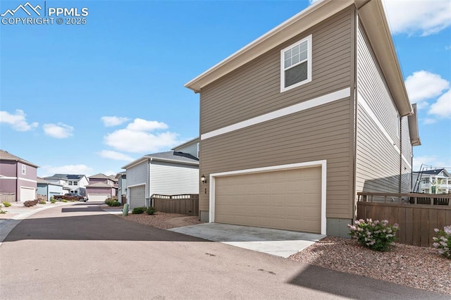 48 Mayflower Park Pl, Colorado Springs, CO 80905 - view of side of property with a residential view and a garage