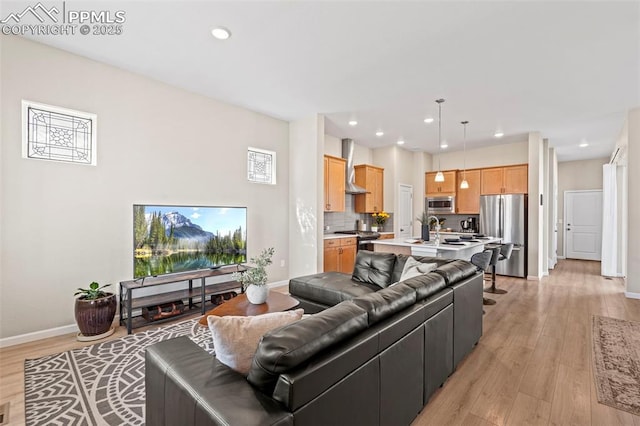 48 Mayflower Park Pl, Colorado Springs, CO 80905 - living area featuring baseboards, light wood-style floors, and recessed lighting