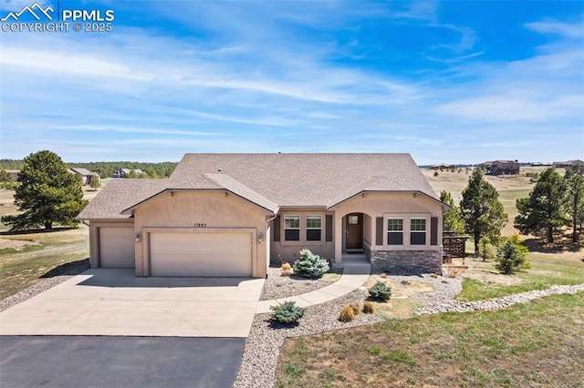 ranch-style home featuring an attached garage, a shingled roof, concrete driveway, and stucco siding