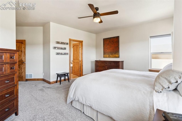 carpeted bedroom with baseboards, visible vents, and ceiling fan