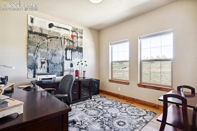office space featuring wood finished floors and baseboards