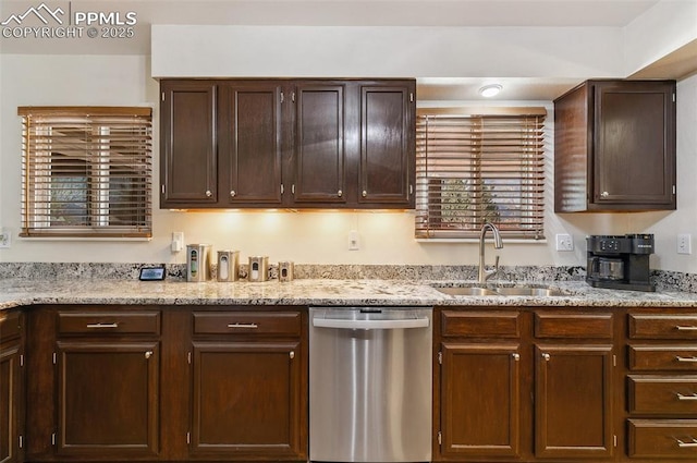620 Jayton Dr, Colorado Springs, CO 80911 - kitchen featuring dark brown cabinets, light stone countertops, stainless steel dishwasher, and a sink