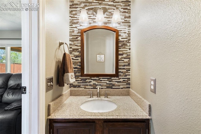 620 Jayton Dr, Colorado Springs, CO 80911 - bathroom featuring a textured wall and vanity