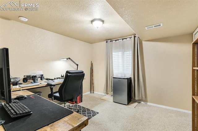 620 Jayton Dr, Colorado Springs, CO 80911 - home office featuring baseboards, a textured ceiling, and visible vents