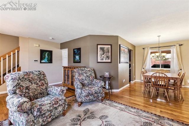 620 Jayton Dr, Colorado Springs, CO 80911 - living area with baseboards, a notable chandelier, and wood finished floors