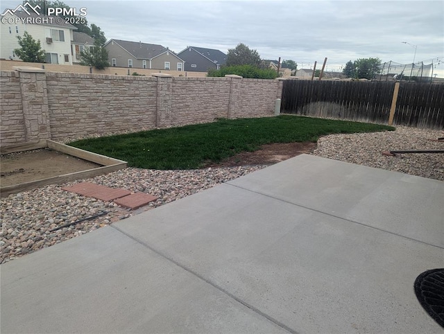 7256 Josh Byers Way, Fountain, CO 80817 - fenced backyard featuring a patio and a residential view