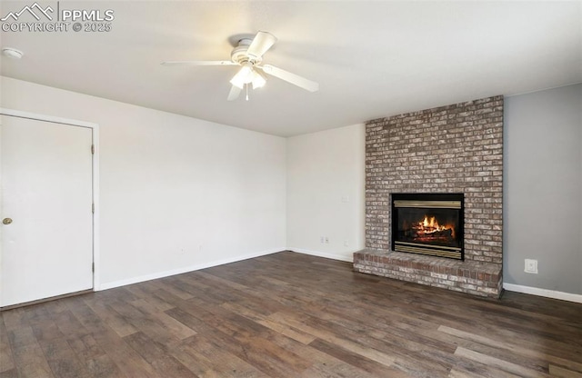 8246 Pinegate Dr, Colorado Springs, CO 80925 - unfurnished living room with wood finished floors, a ceiling fan, and a brick fireplace