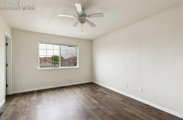 8246 Pinegate Dr, Colorado Springs, CO 80925 - unfurnished room featuring dark wood-type flooring and a ceiling fan
