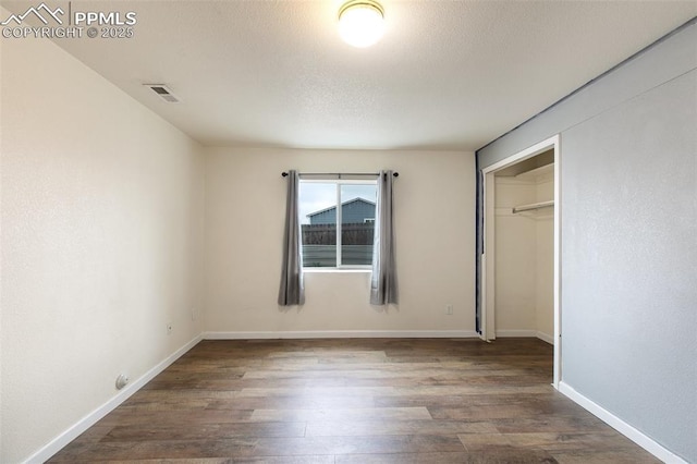 8246 Pinegate Dr, Colorado Springs, CO 80925 - unfurnished bedroom featuring wood finished floors and a closet