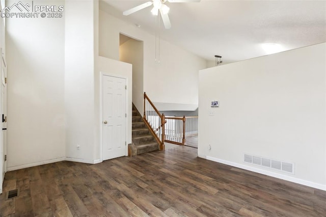 8246 Pinegate Dr, Colorado Springs, CO 80925 - spare room with a ceiling fan, wood finished floors, stairway, and high vaulted ceiling