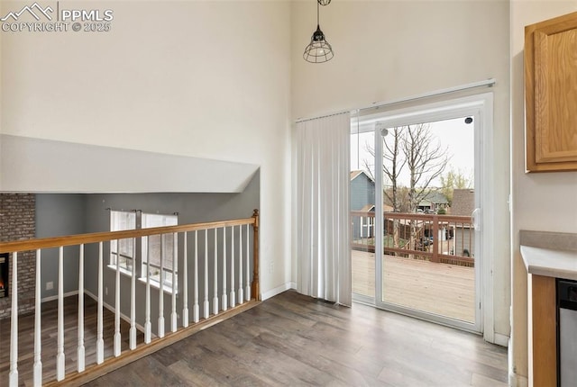 8246 Pinegate Dr, Colorado Springs, CO 80925 - interior space featuring wood finished floors and a brick fireplace
