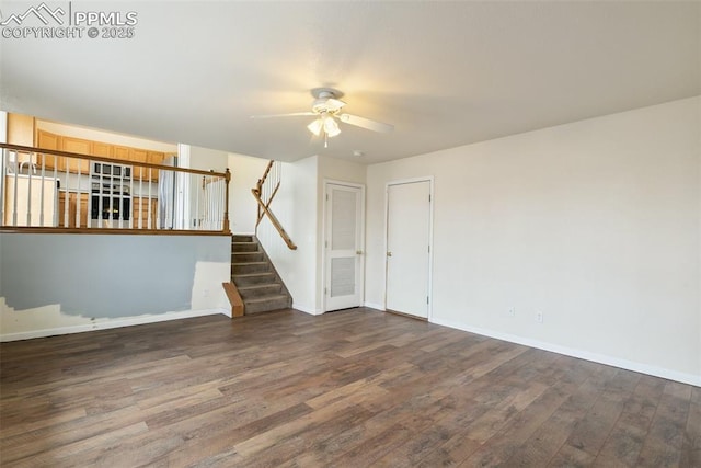 8246 Pinegate Dr, Colorado Springs, CO 80925 - empty room featuring a ceiling fan, wood finished floors, and stairway