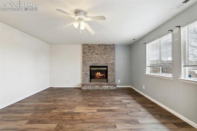 8246 Pinegate Dr, Colorado Springs, CO 80925 - unfurnished living room with ceiling fan, wood finished floors, and a fireplace
