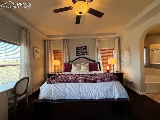 10088 Stonemont Dr, Peyton, CO 80831 - bedroom featuring a ceiling fan, baseboards, and arched walkways