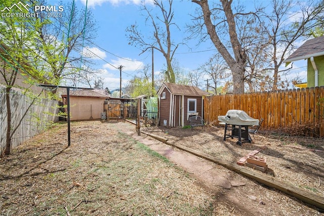 1903 W Colorado Ave, Colorado Springs, CO 80904 - view of yard featuring a fenced backyard, an outdoor structure, and a shed
