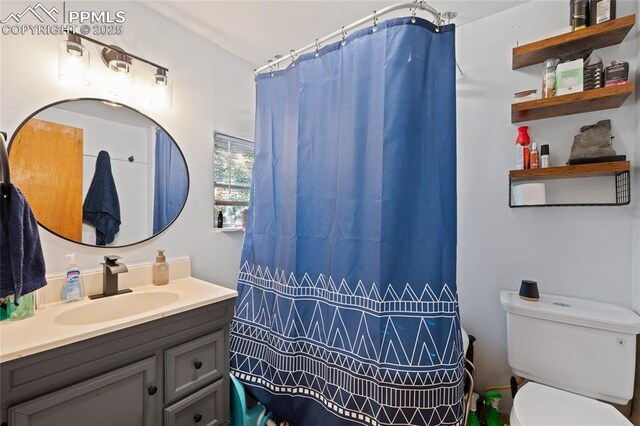 1903 W Colorado Ave, Colorado Springs, CO 80904 - full bathroom featuring toilet, vanity, and a shower with curtain
